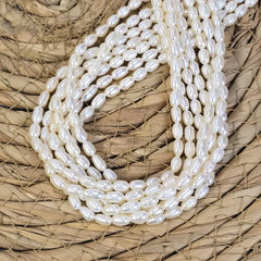 White Rice Pearls, White Oval Freshwater Pearls, Genuine Teardrop Pearls Jewelry Making Supplies, Rice Beads 4x7mm Full Strand 15.5" FWP029